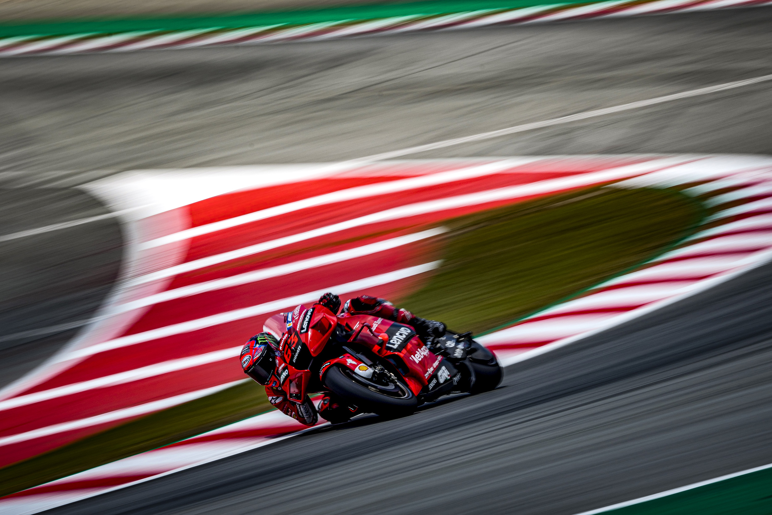 motogp-rider-leaning-low-as-he-takes-a-corner-at-high-speed.jpeg