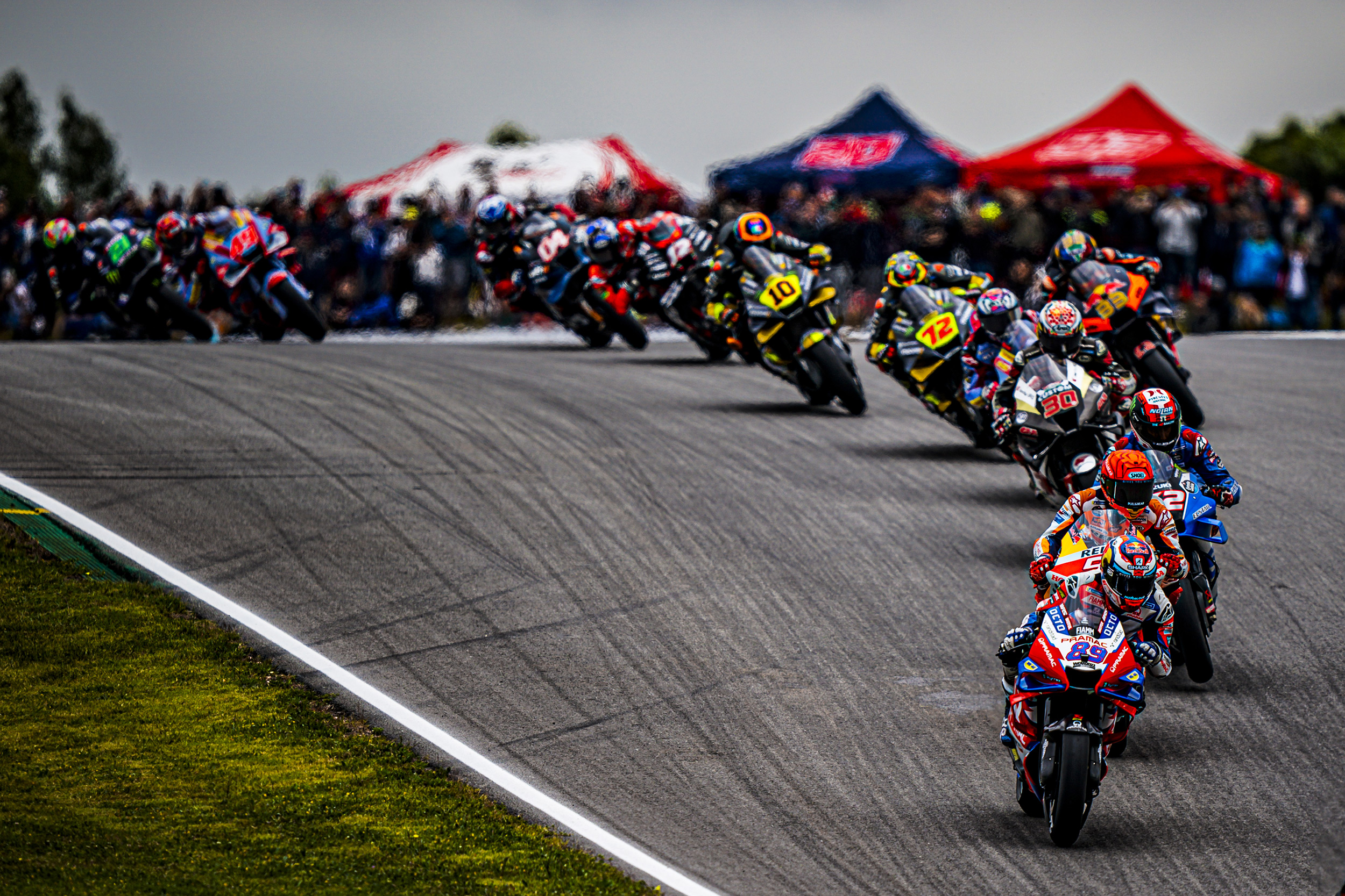 group-of-motogp-riders-coming-round-a-corner.jpeg