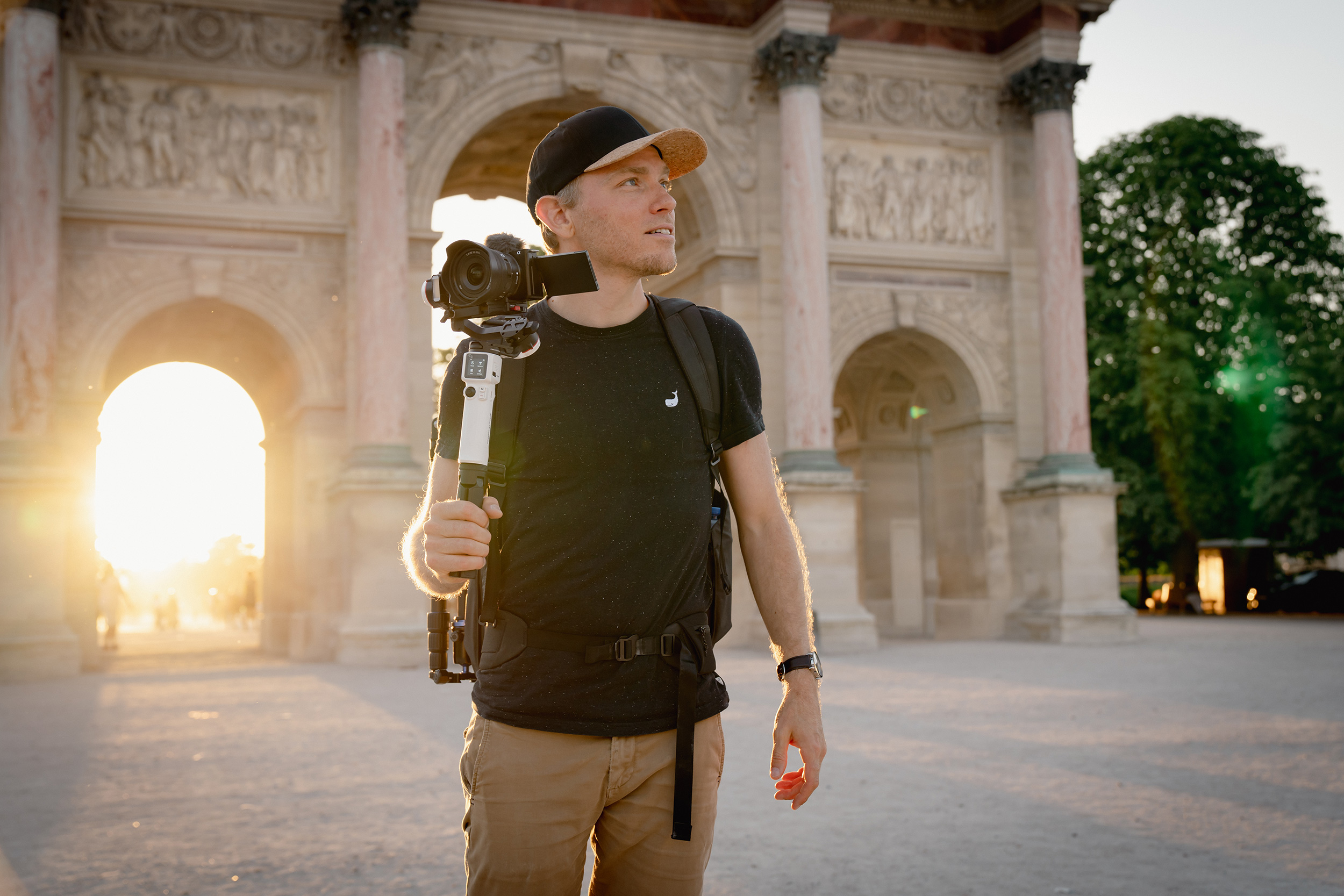 man-holding-a-gimbal-with-a-sony-camera-mounted-on-it.jpeg