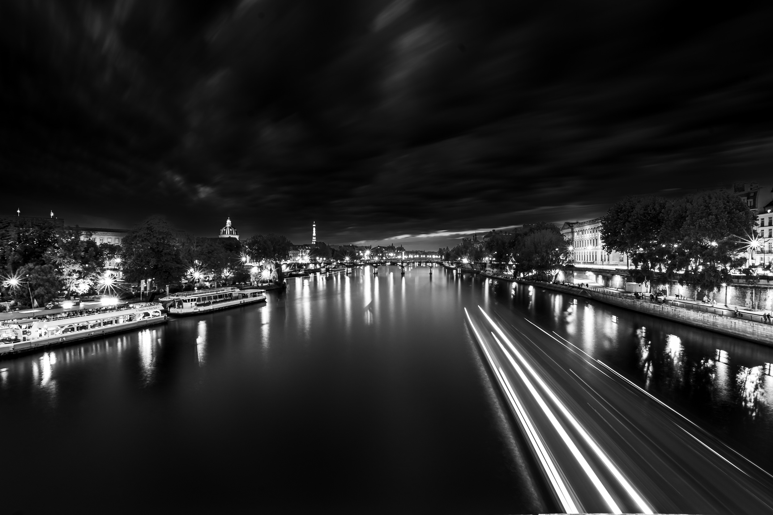 night-time-shot-of-paris-taken-from-a-bridge.jpeg