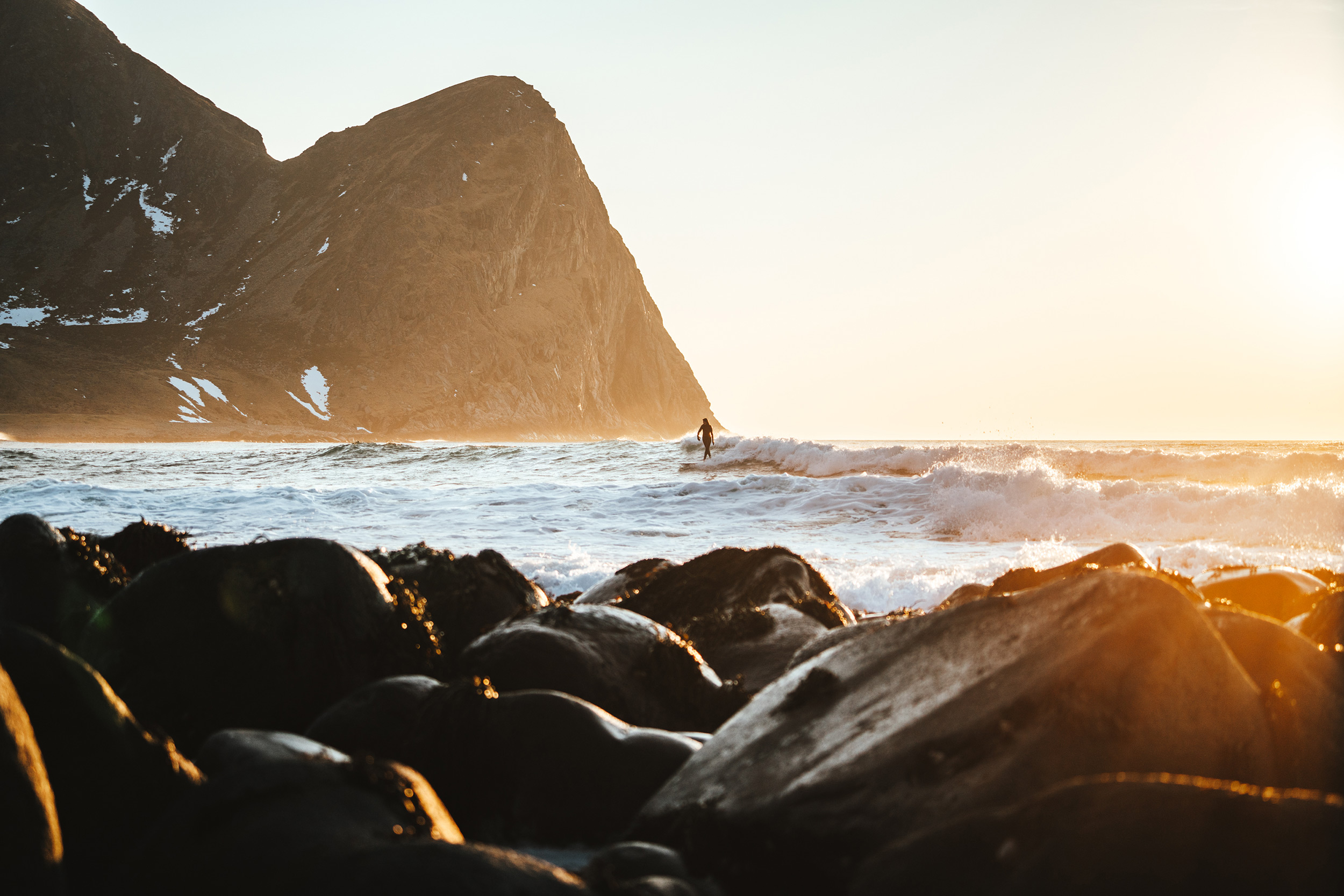 person-walking-in-the-waves-along-the-beach.jpeg