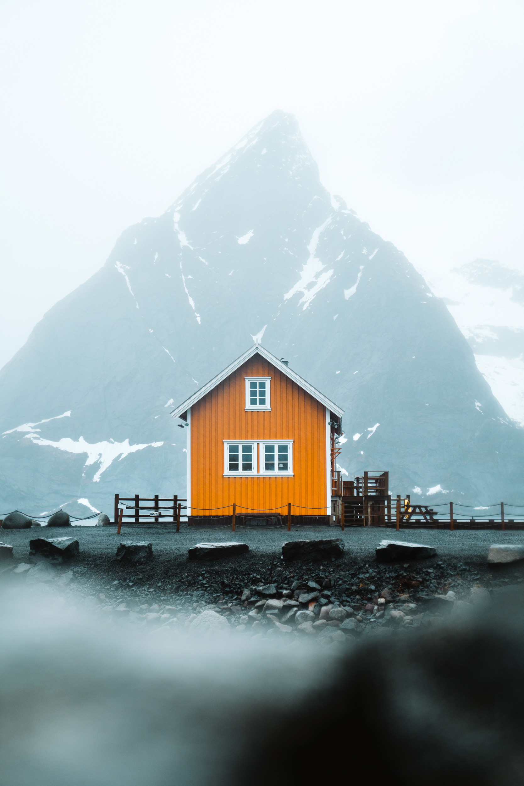 red-hut-in-front-of-a-misty-mountain.jpeg