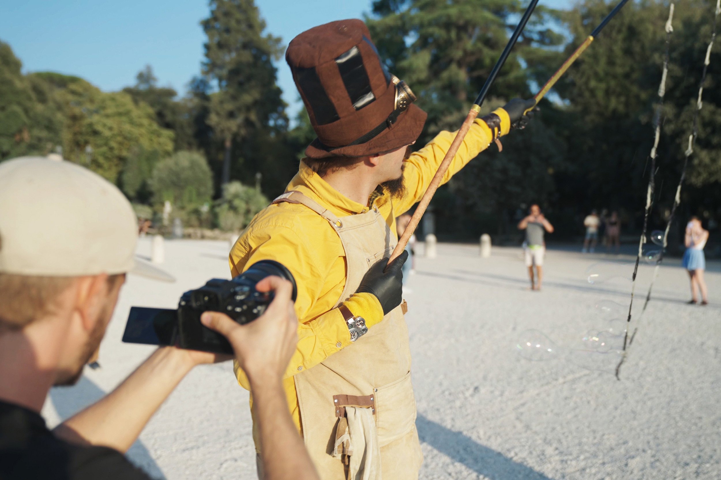 matteo-bruno-framing-a-shot-of-a-man-wearing-a-large-hat.jpeg