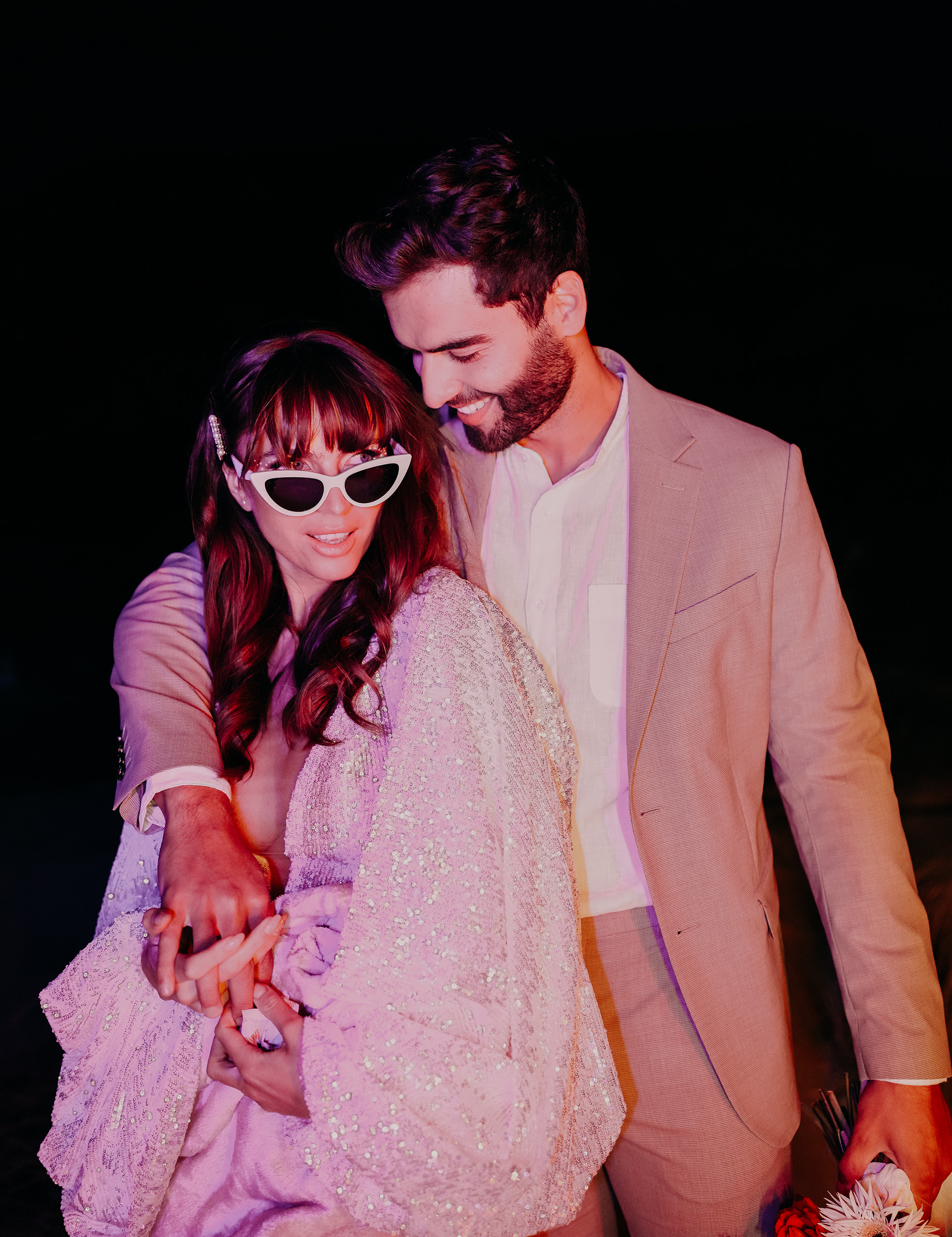 bride-and-groom-looking-happy-at-night.jpg