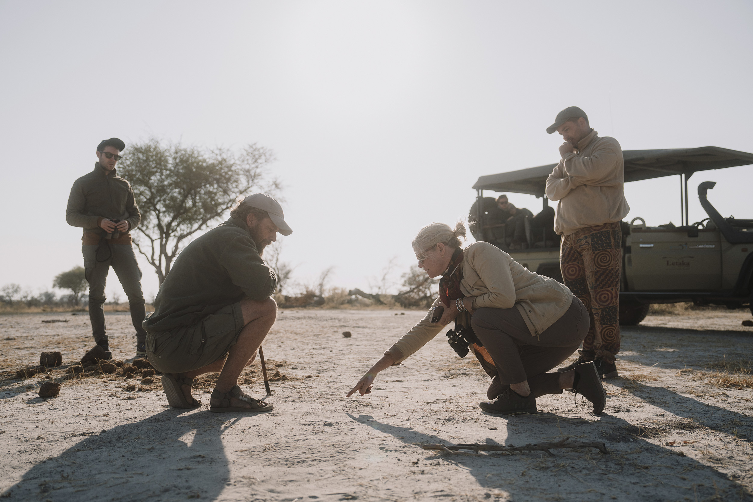 lady-pointing-at-the-dusty-ground.jpg