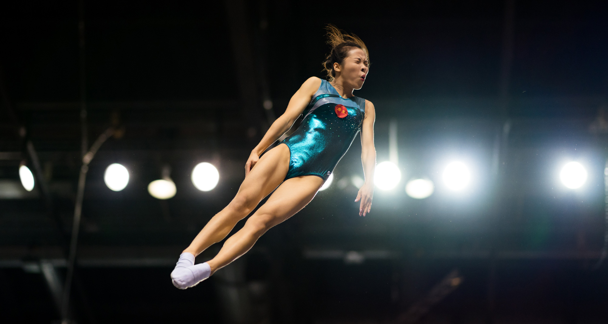 terry-donnelly-sony-alpha-9-gymnast-leaps-in-the-air-with-her-eyes-closed.jpeg